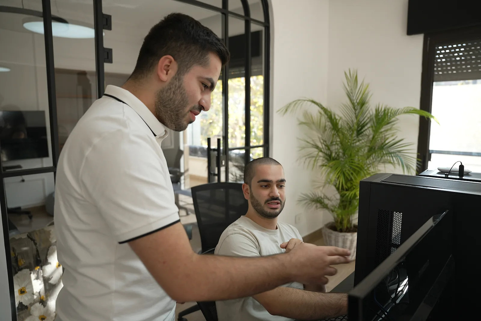 Two Logisoft developers working through a problem together